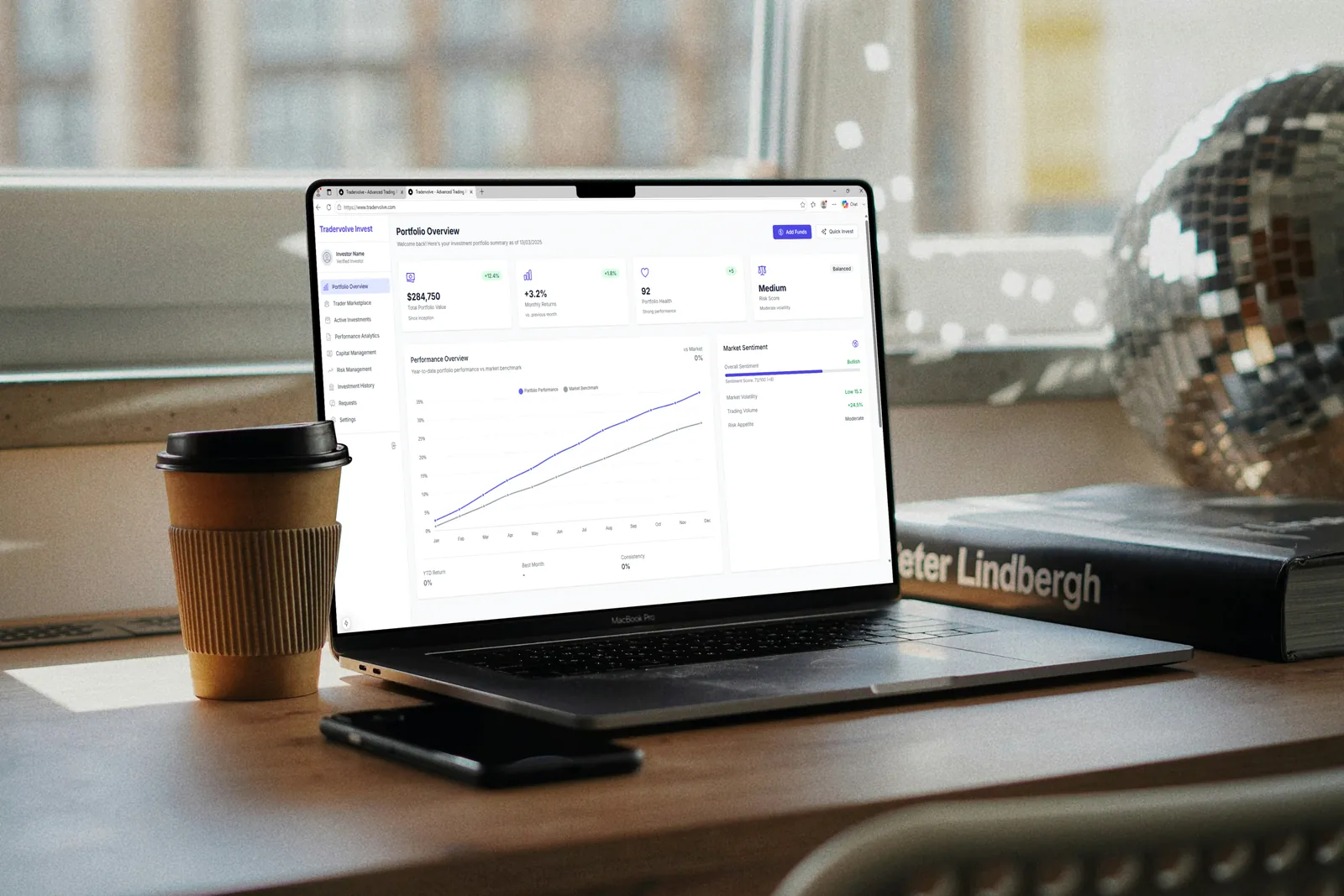 Tradervolve's performance dashboard on a laptop